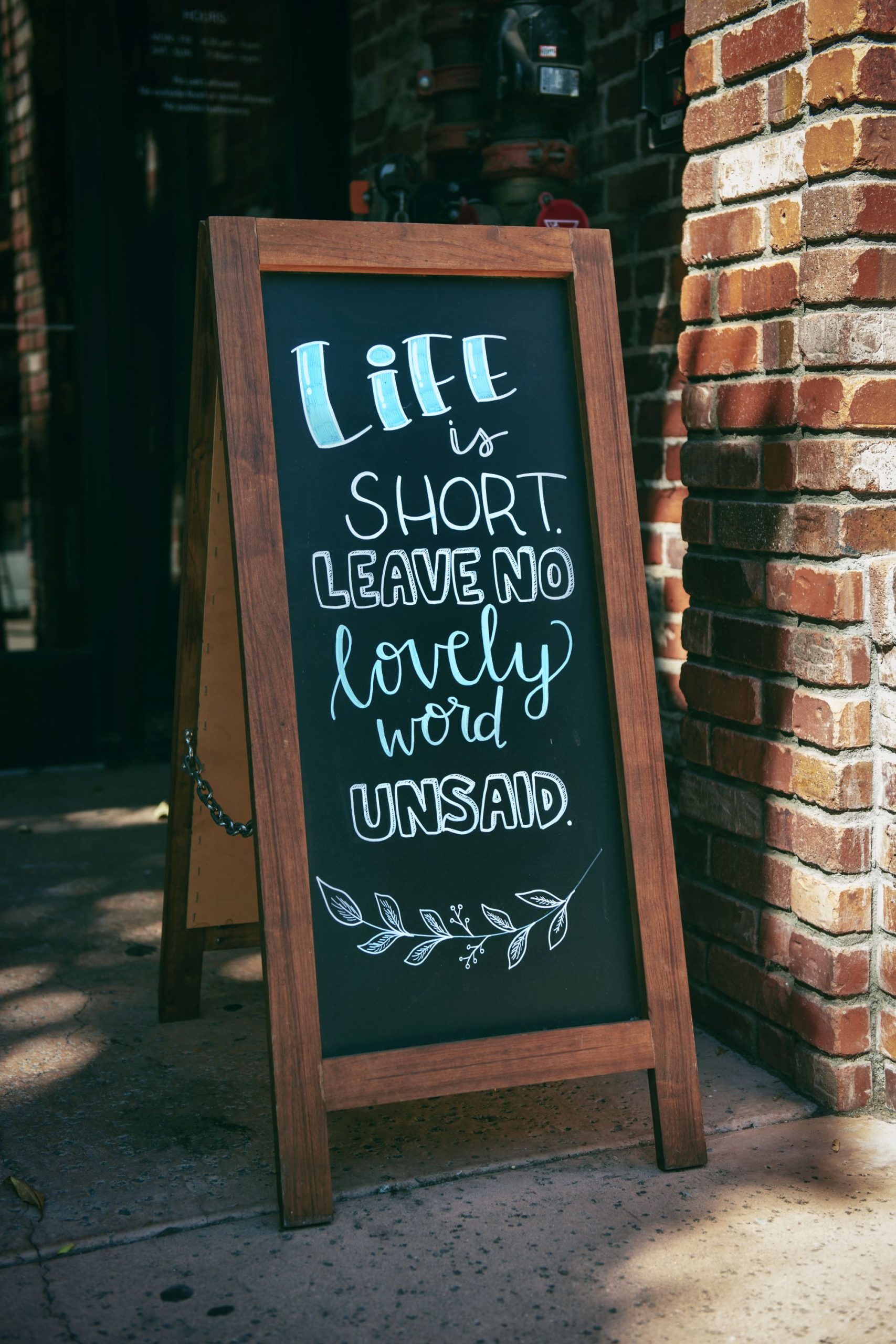 Where to find the right keywords. Sign with "Life is short, leave no lovely word unsaid" written on it.